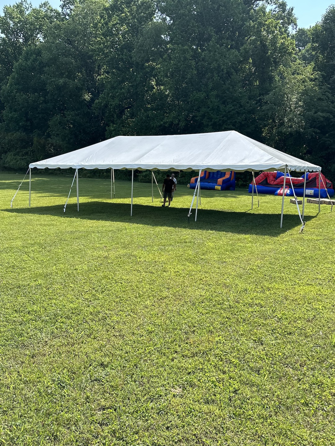 Large Party Frame Tent with Bounce House and Inflatable Game in Randallstown, MD