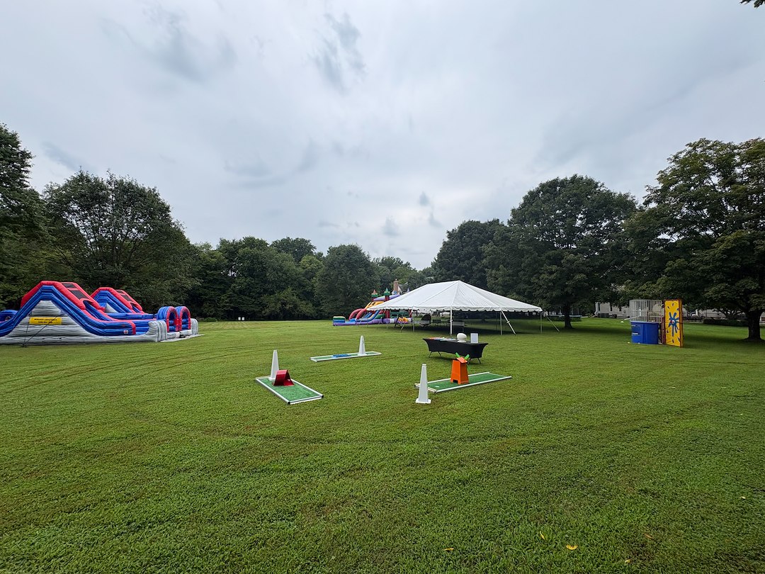 Large Party Tent, 3-hole Mini Golf, XL Bounce House with Slide, and Double Inflatable Obstacle Course for Corporate Event in Howard County, MD